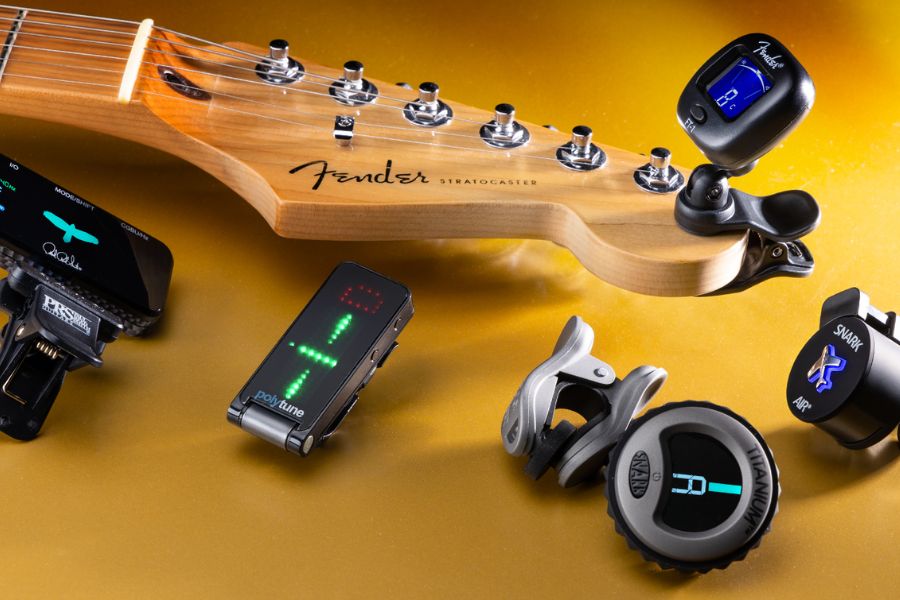 A clip-on tuner or a pedal tuner works great