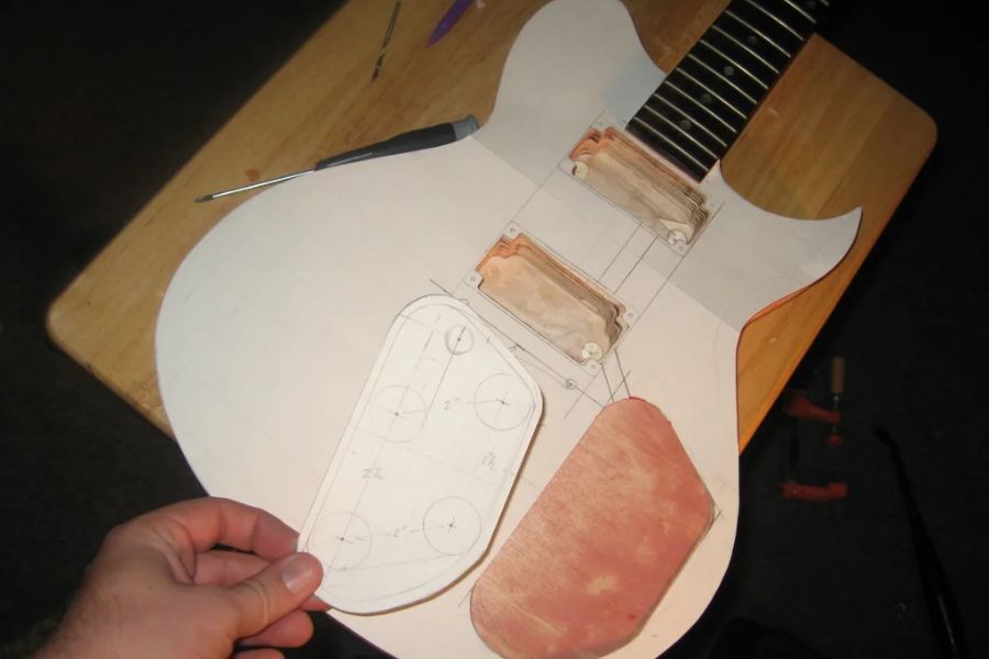 The drawing should have exact measurements and show how the guitar is put together